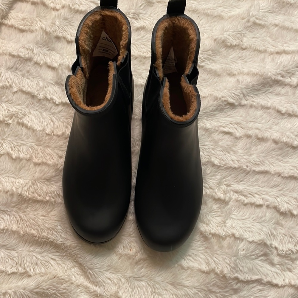 Black rain boots. These were not utilized- not functional for local climate.